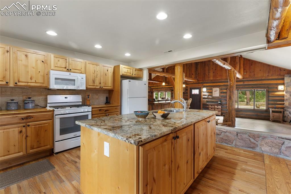 Image 24 of 48: Beautiful cabinetry and butcher block counters
