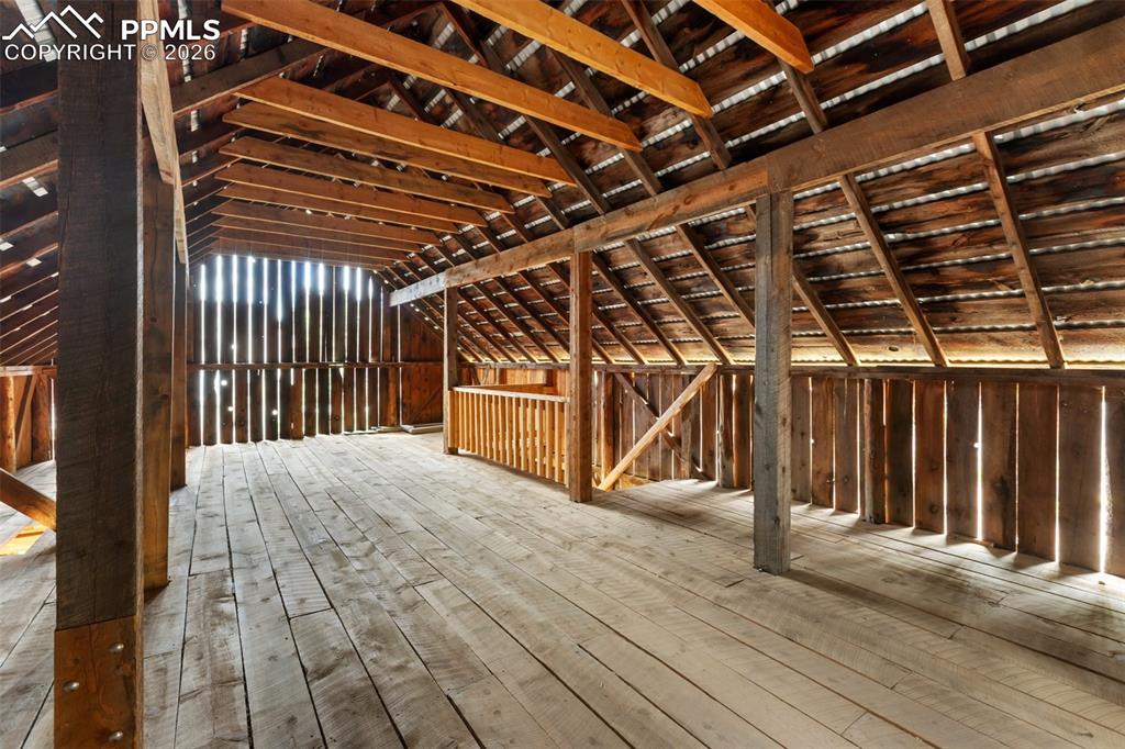 Image 37 of 48: The wooded property also includes the historic barn (built in 1886), ice ho