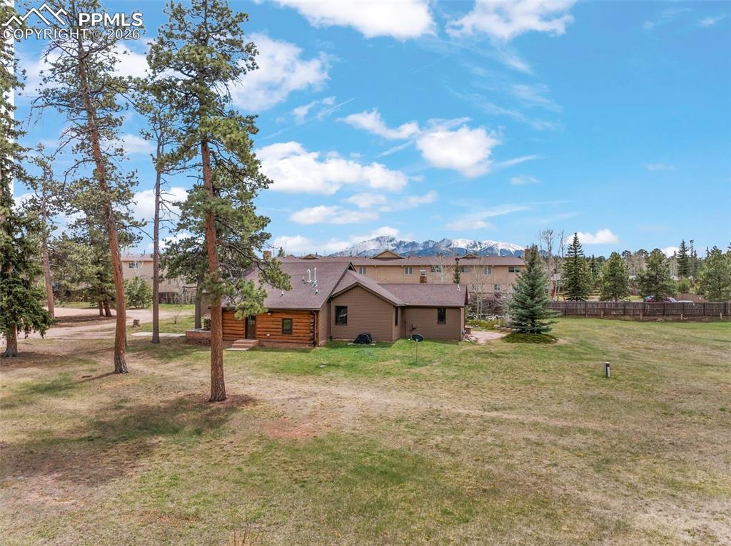 Image 4 of 48: This 1930s ranch-style log cabin was meticulously converted into a residenc