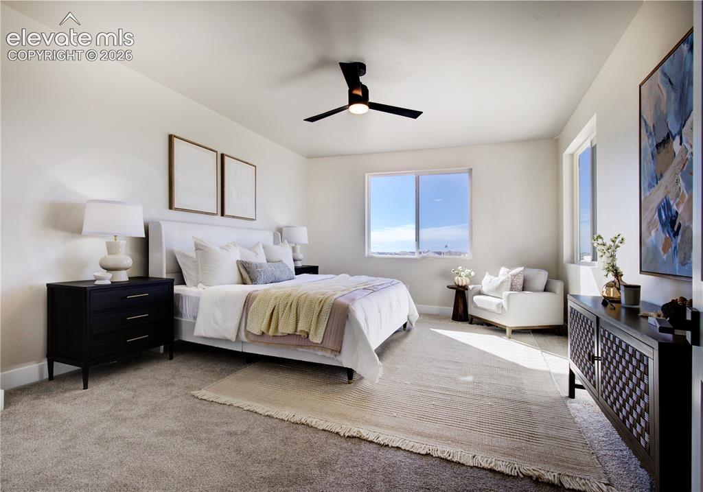 Image 14 of 35: Spacious room featuring neutral wall tones, plush carpet flooring, a modern