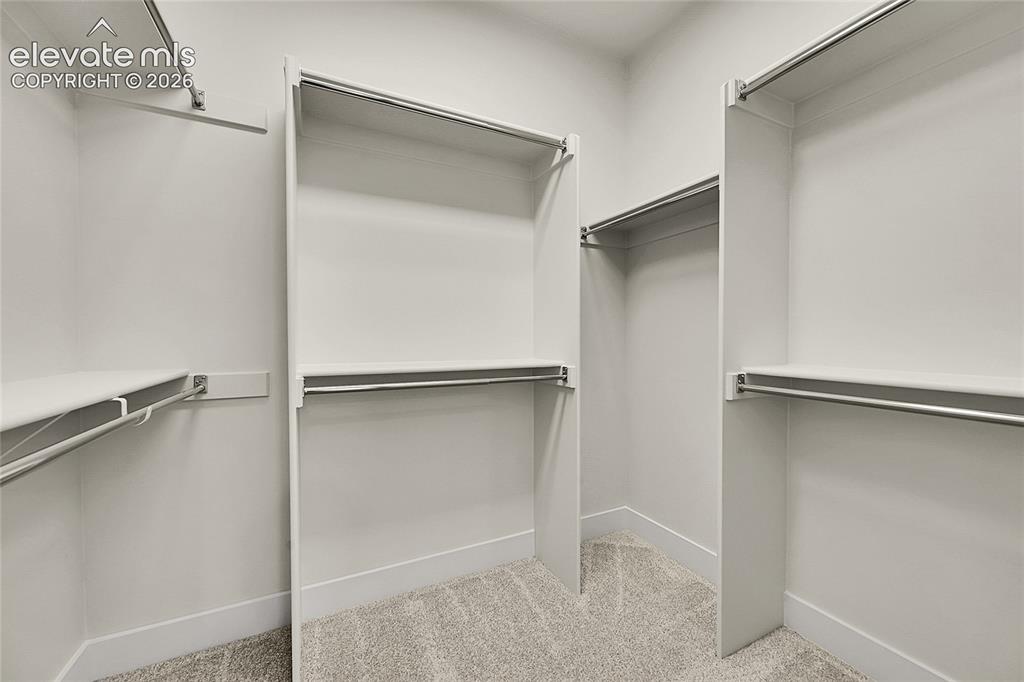 Image 19 of 35: Walk in closet