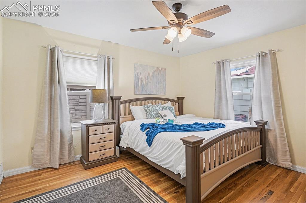 Image 10 of 25: Spacious master bedroom with real hardwood floors