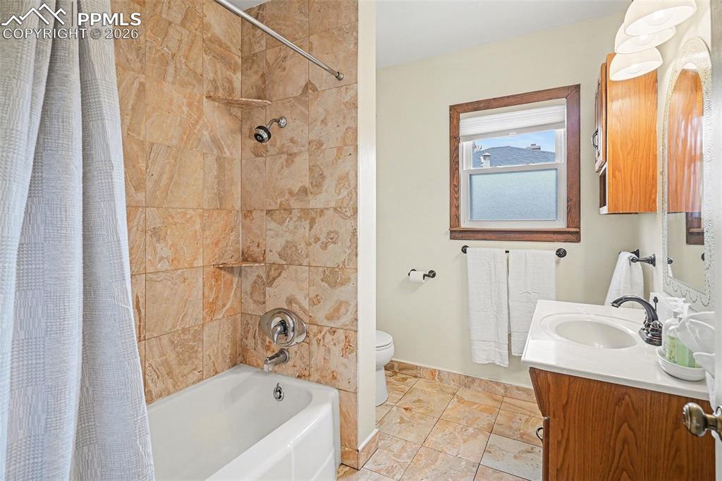 Image 12 of 25: Beautiful ceramic tile shower and flooring
