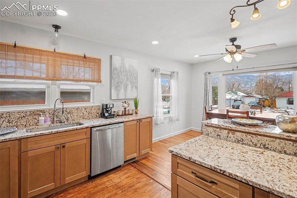 Image 9 of 25: Bright, open layout from kitchen to dining area with fantastic views!