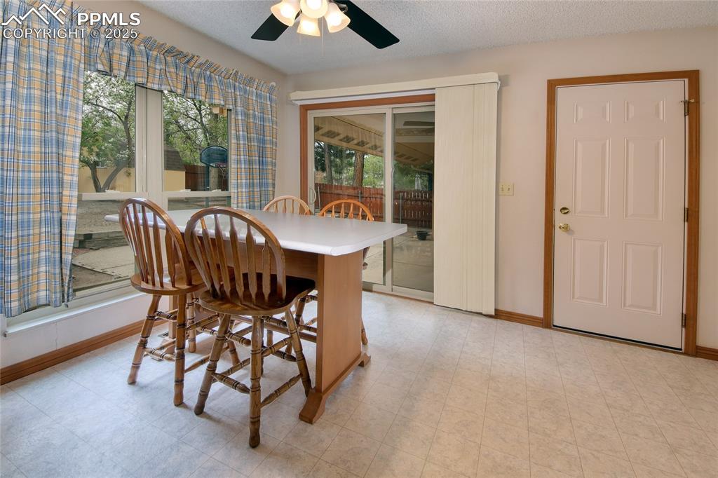 Image 14 of 48: Eating space with natural light and walk-out to yard and garage