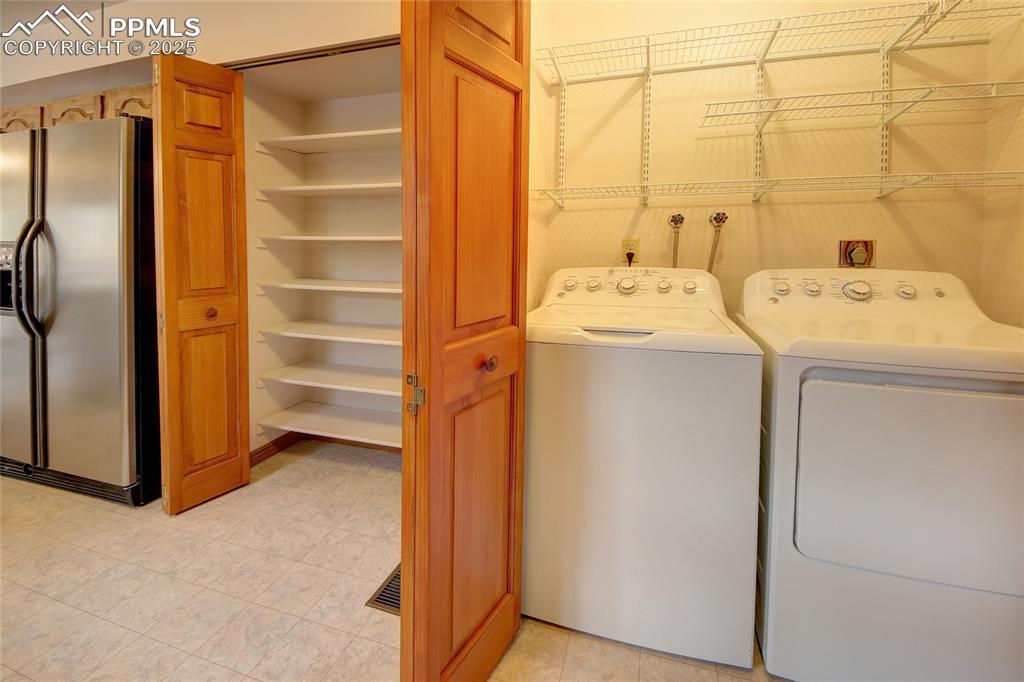 Image 15 of 48: Pantry and laundry 