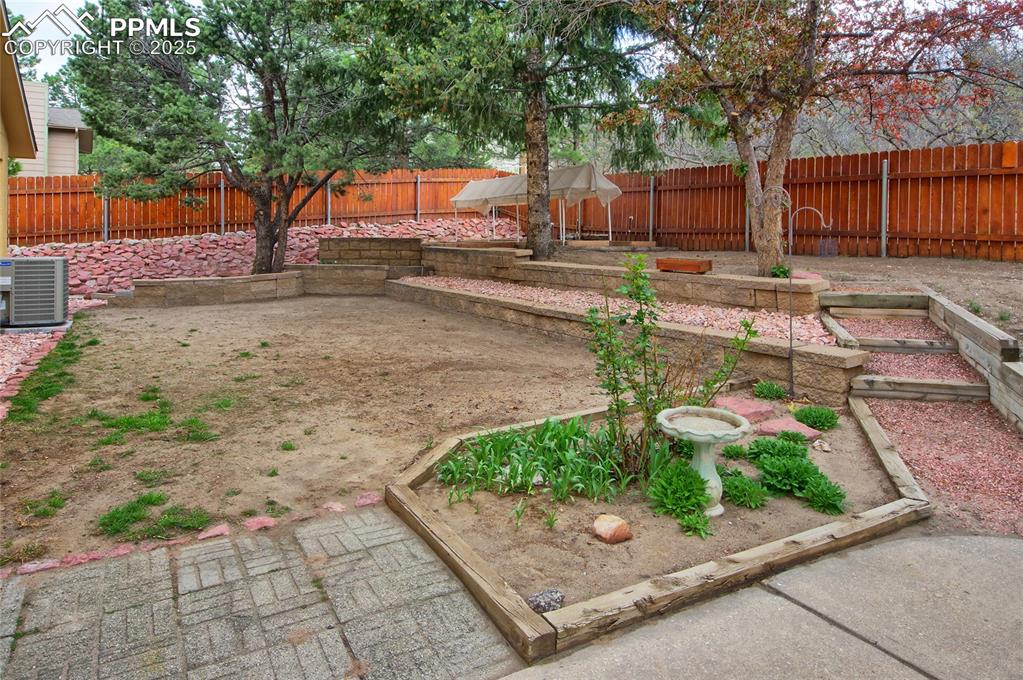 Image 37 of 48: Fenced backyard, terraced and ready for your touch