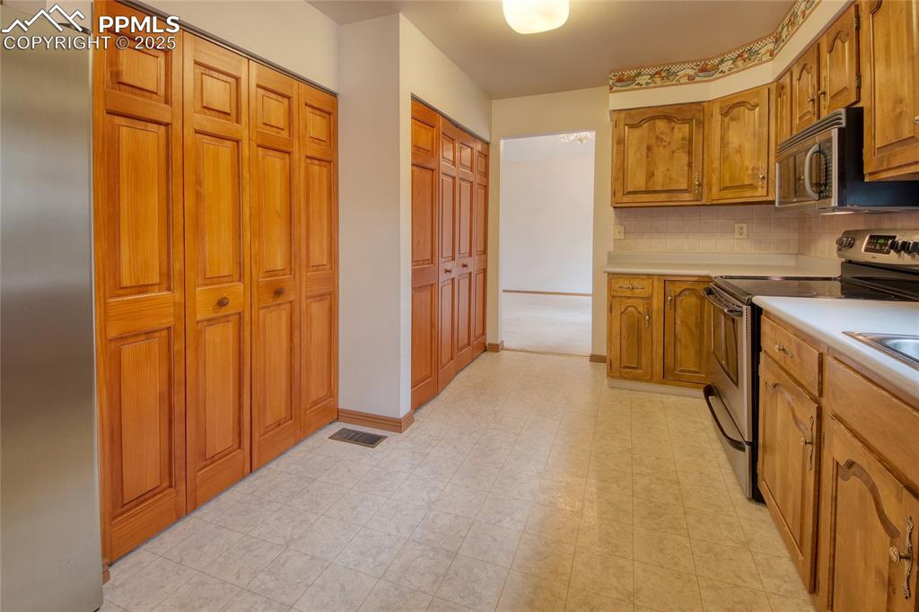 Image 9 of 48: Kitchen with pantry 