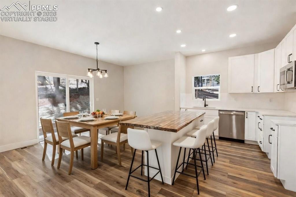 Image 11 of 44: Kitchen, family and dining room