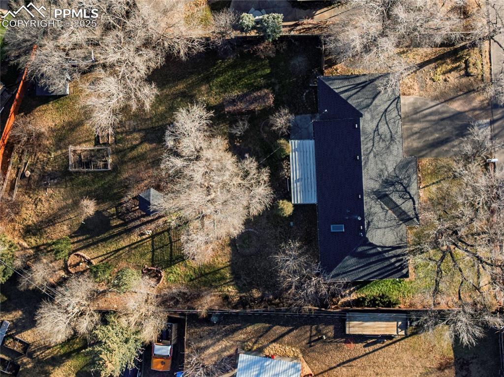 Image 4 of 44: 12,300 square foot lot features a large fenced backyard.