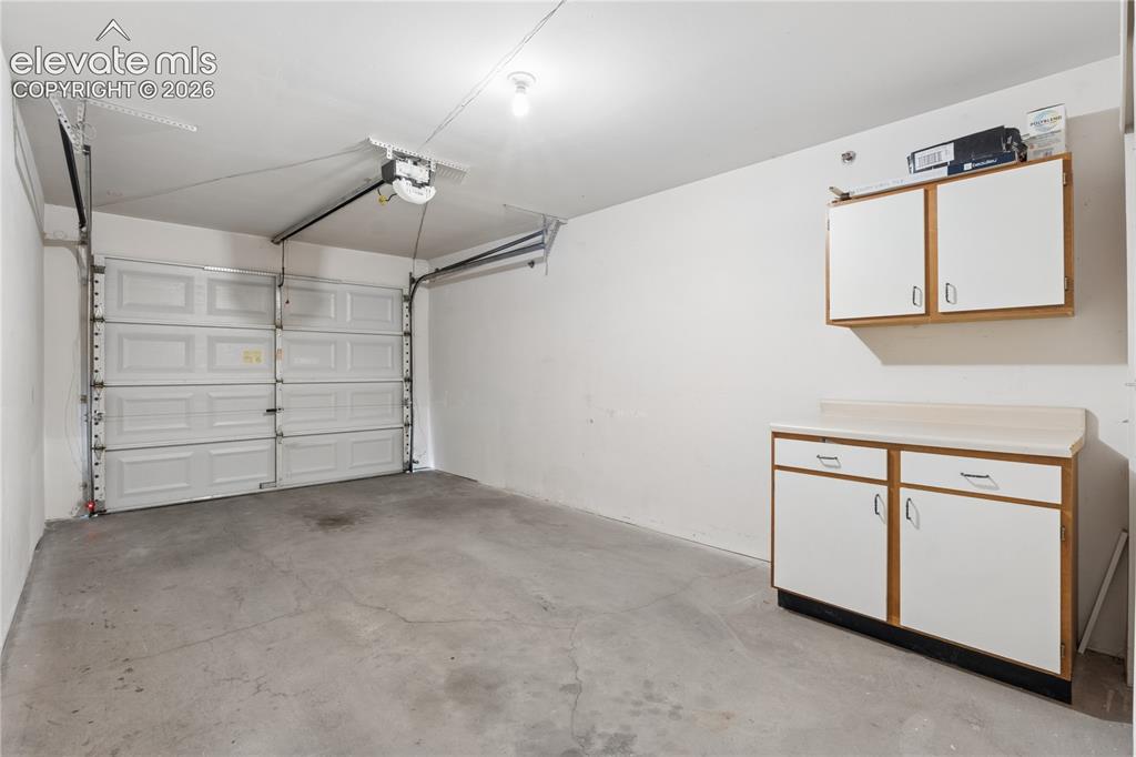 Image 20 of 25: Storage closet and cabinets