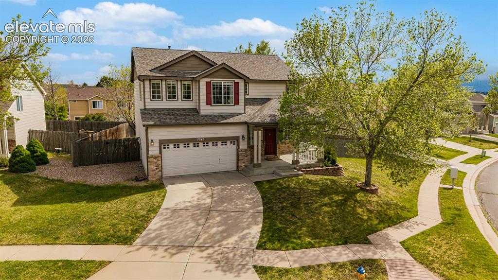 Caption: Stunning two-story home on a oversized lot designed for privacy