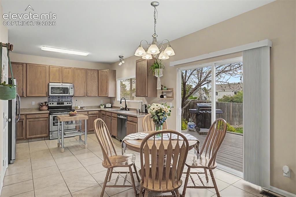 Image 10 of 45: Built-in fireplace feature with light-toned walls and trim, complemented by