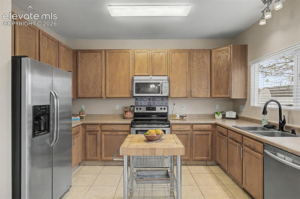 Image 13 of 45: Kitchen featuring stainless steel appliances, all included
