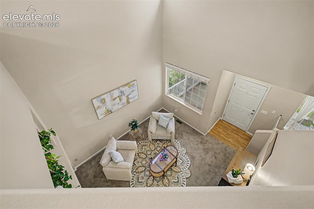 Image 19 of 45: Dedicated laundry area featuring a stacked washer and dryer unit