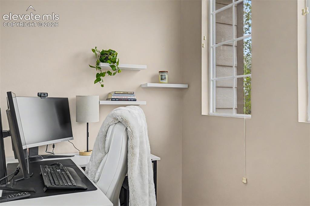 Image 33 of 45: Versatile room with neutral wall tones and carpeted flooring is perfect fo