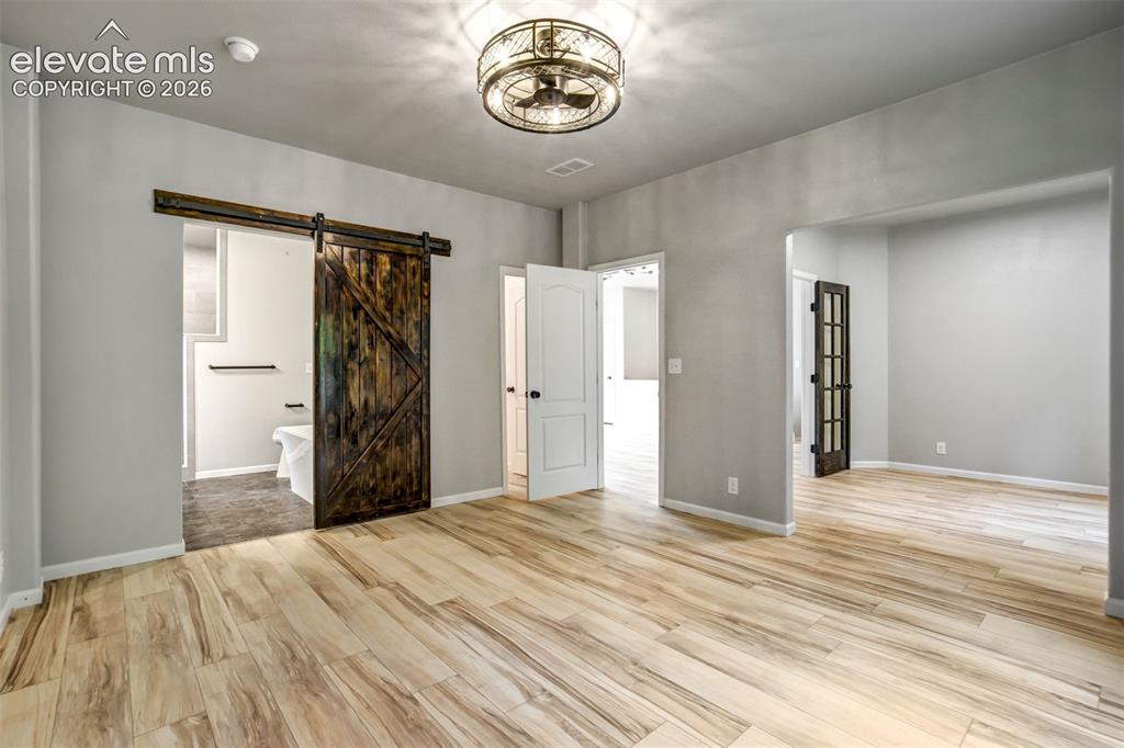 Image 16 of 48: Primary suite with sitting room/ office/nursery/Pilates studio/den