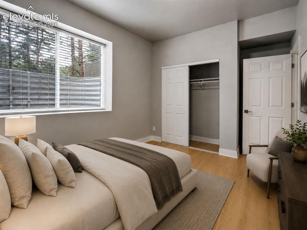 Image 37 of 48: Light wood-finish flooring complements neutral wall tones in this room feat
