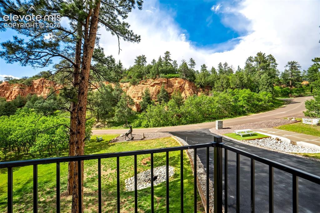 Image 41 of 48: Front Expansive natural landscape featuring a prominent rock formation, mat