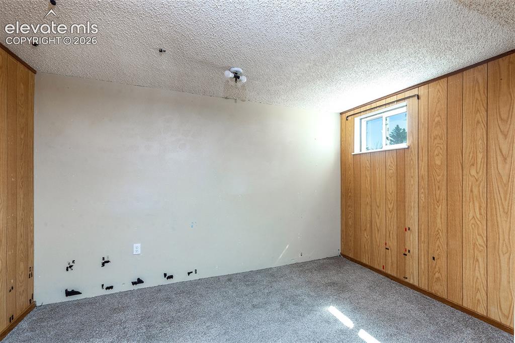 Image 25 of 37: Basement Level Office - French Doors - Carpet needs Replacement