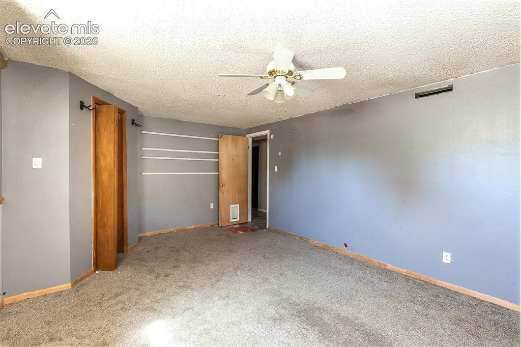 Image 30 of 37: Basement Bedroom #5 - Carpet needs replacement
