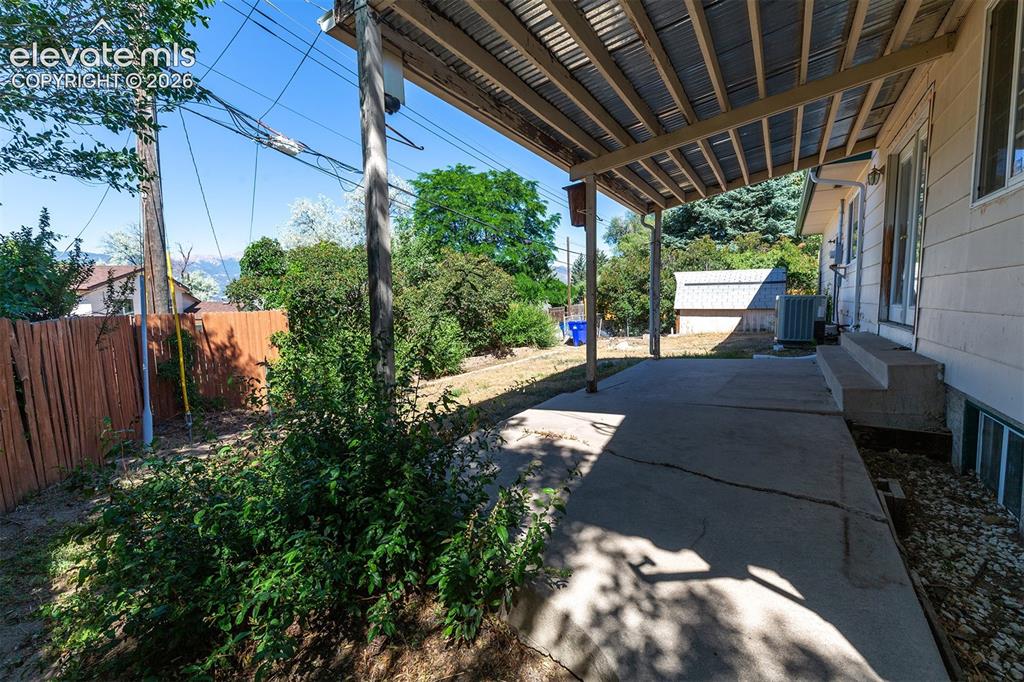 Image 31 of 37: Covered Patio - Some Concrete Damage
