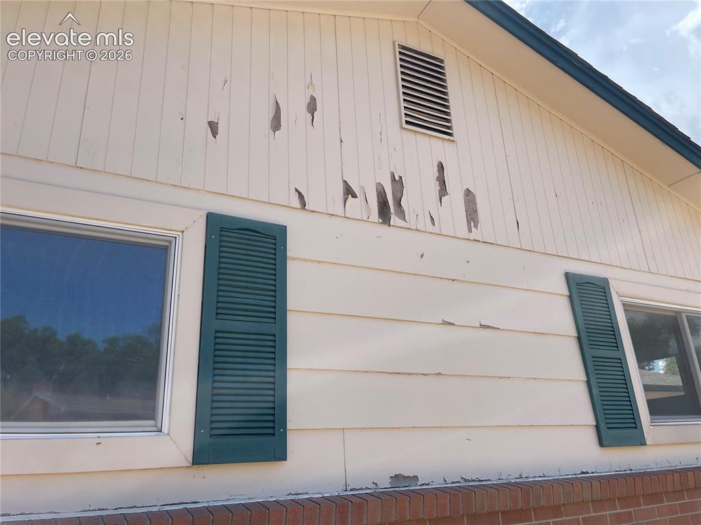 Image 36 of 37: Siding Damage