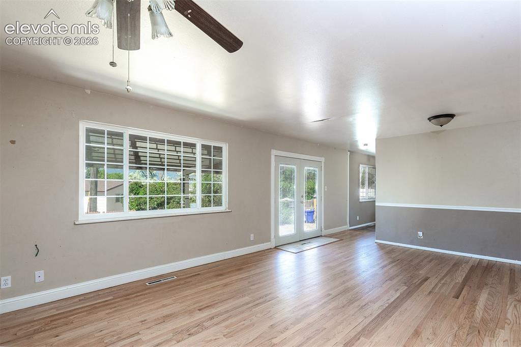 Image 9 of 37: Spacious Main Level Living Room - Walk-out to Covered Patio