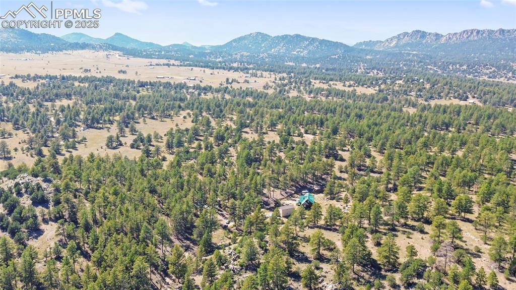 Image 31 of 33: Aerial view of a mountain backdrop