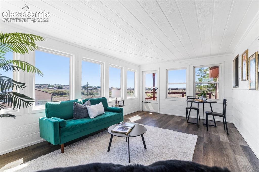 Image 16 of 44: Beautiful sunroom to enjoy any time of day.  Fully enclosed and wall to wal