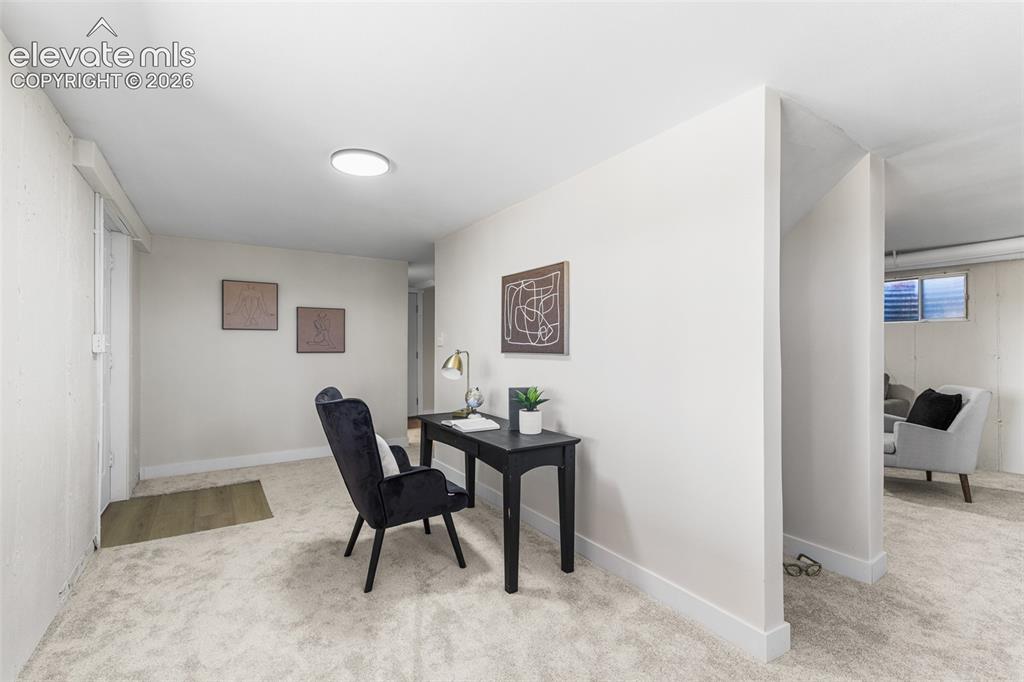 Image 31 of 44: This space in on the other side of the family room. Perfect for a play area