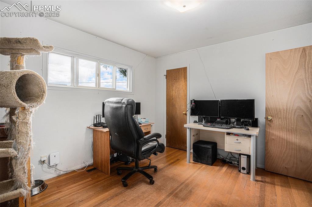 Image 19 of 30: Office space featuring light wood-style floors