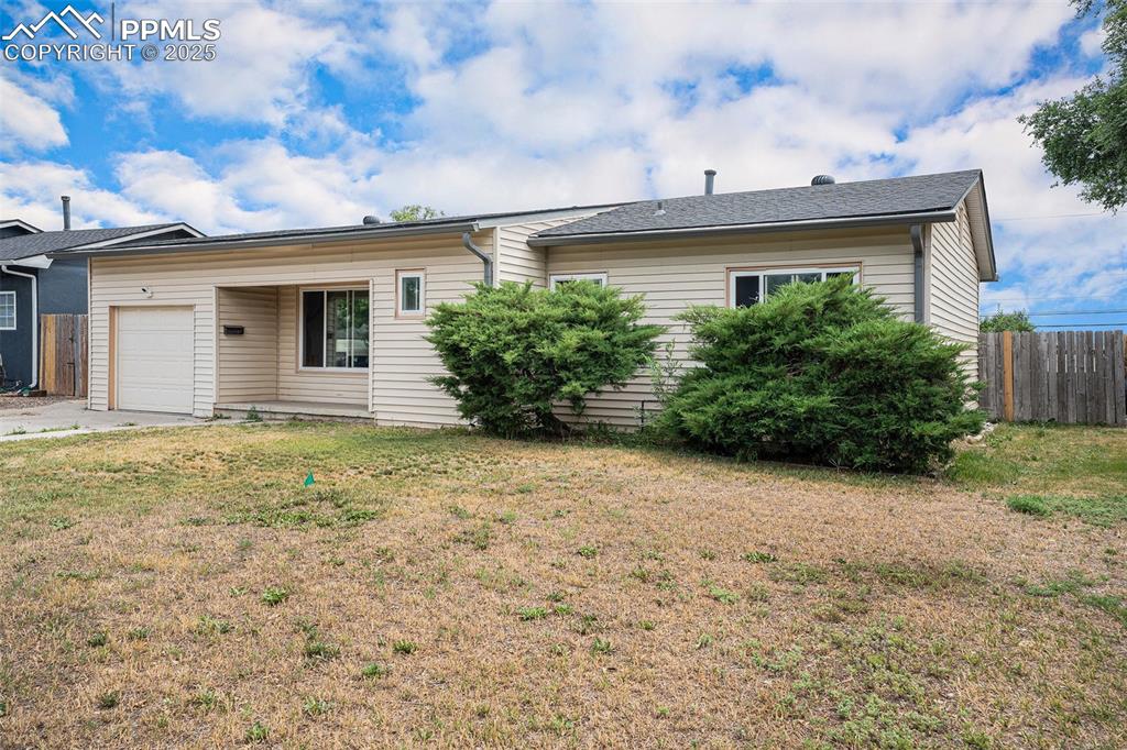 Image 3 of 30: Ranch-style home featuring an attached garage