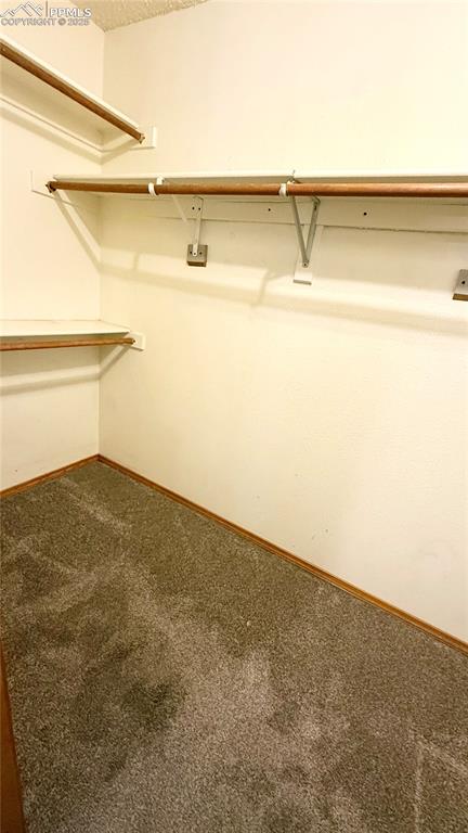 Image 7 of 16: Master bedroom closet
