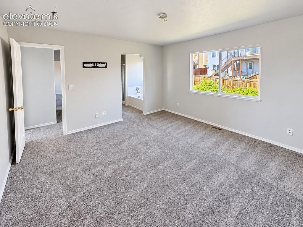 Image 13 of 32: Primary Bedroom Suite with Large Walk-in Closet and 5-Piece Bathroom