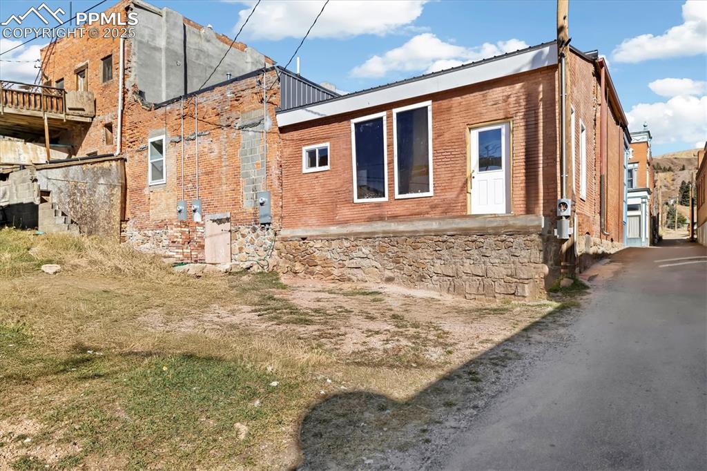 Image 31 of 43: Back of building virtually altered to show potential