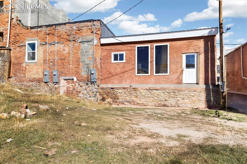 Image 33 of 43: Back of building virtually altered to show potential