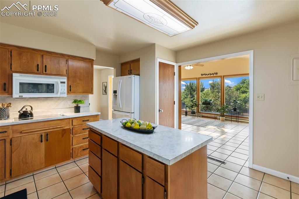 Image 29 of 49: Island and built in pantry
