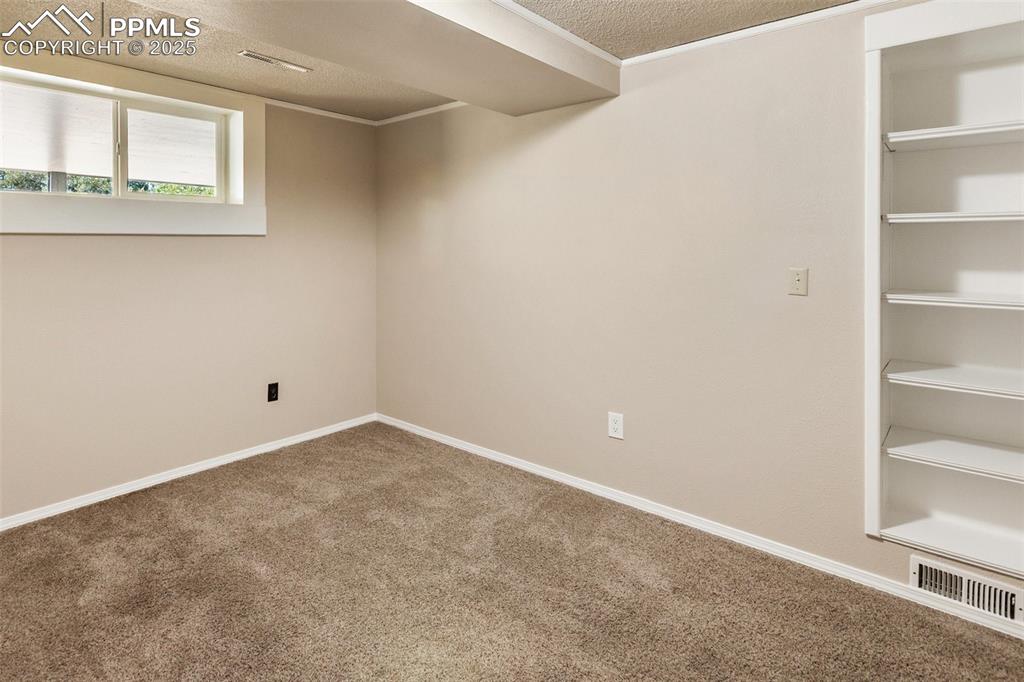 Image 45 of 49: Basement bedroom