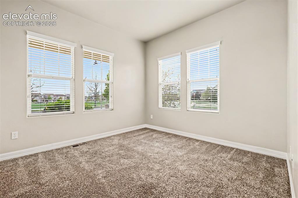 Image 16 of 44: Primary bedroom features a walk-in closet