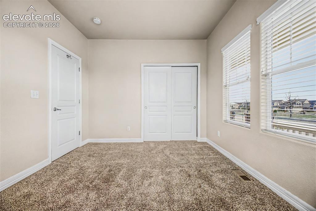 Image 17 of 44: Front bedroom is perfect for guests or a home office