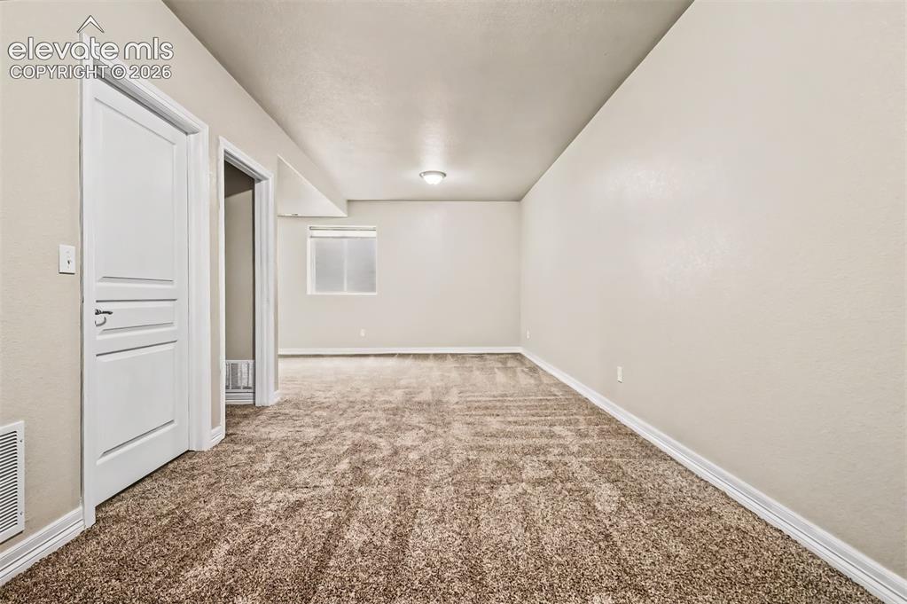 Image 21 of 44: Many options await in the large finished basement which includes a recreati