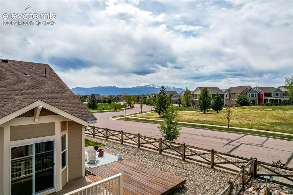 Image 32 of 44: Wood deck offers room to spread out and space to enjoy a fire pit while enj