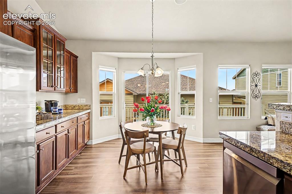 Image 8 of 44: Dining area features an extended kitchen perfect for extra storage and adde