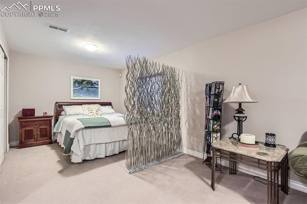 Image 23 of 28: View of carpeted bedroom