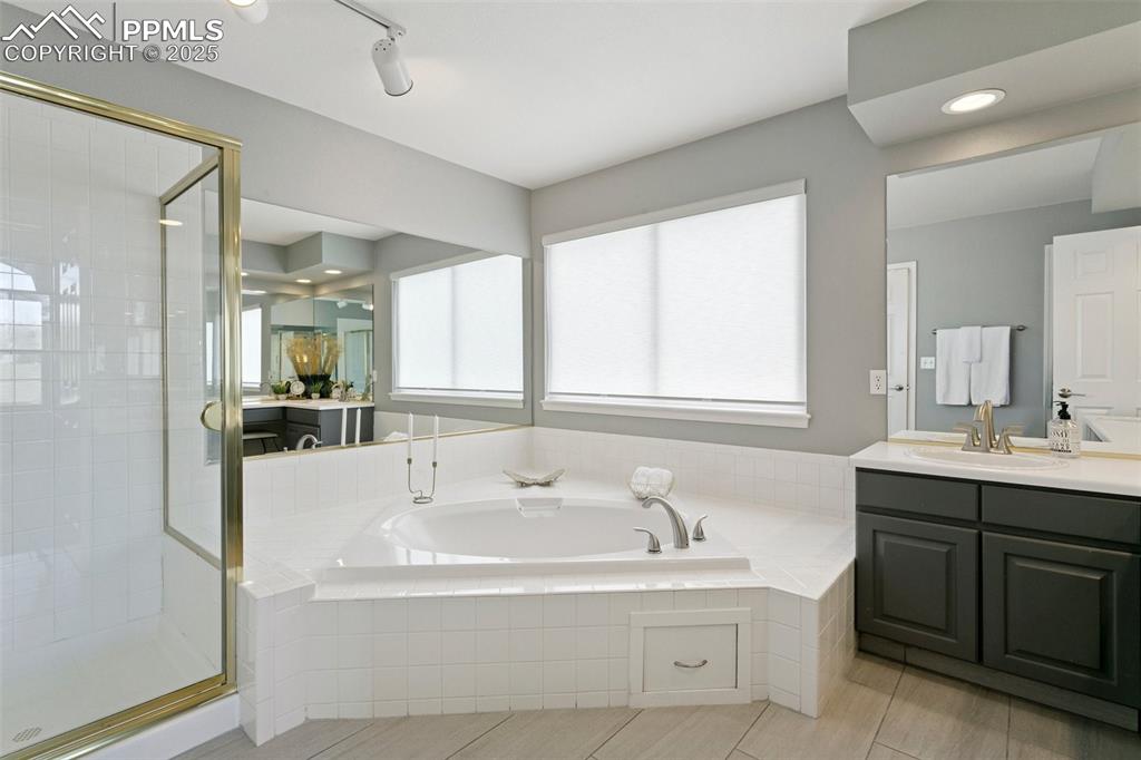 Image 32 of 50: 5-pc primary bath w/corner soaking tub and separate shower!