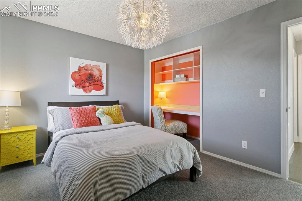 Image 35 of 50: Upper level bedroom