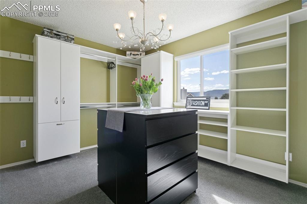 Image 37 of 50: Upper level bedroom (this room was converted into a gorgeous walk-in closet