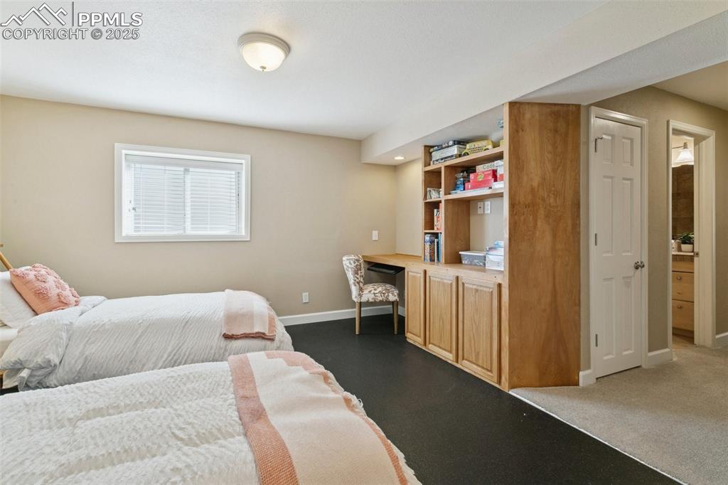 Image 44 of 50: Another view of the Basement flex space w/built-ins!