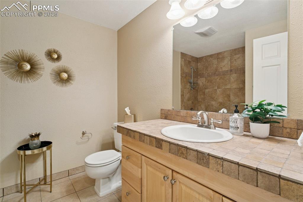 Image 46 of 50: Basement-level full bathroom